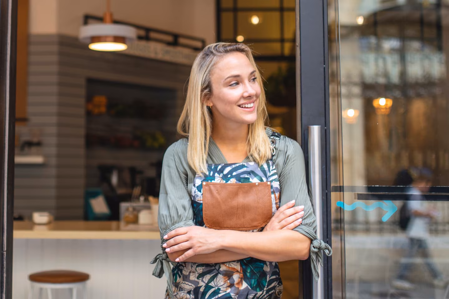 Café owner standing outside